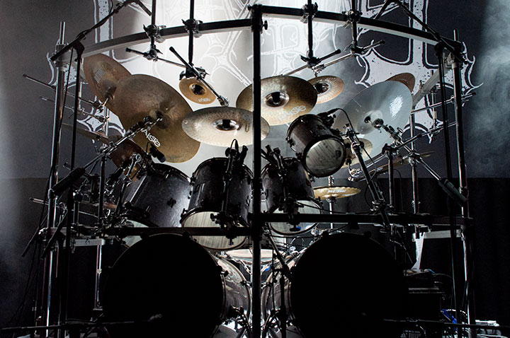 Illustration photo of drumkit with stage lights and a Mayhem backdrop